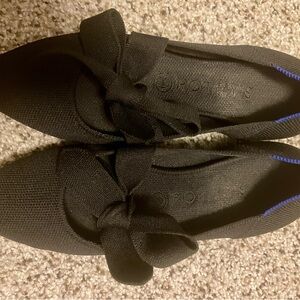 Rothy’s size 8 black, Mary Janes with pointed toe. Bow ties on top